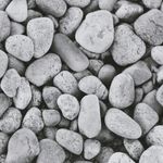 Minimalist zen stones on dark surface